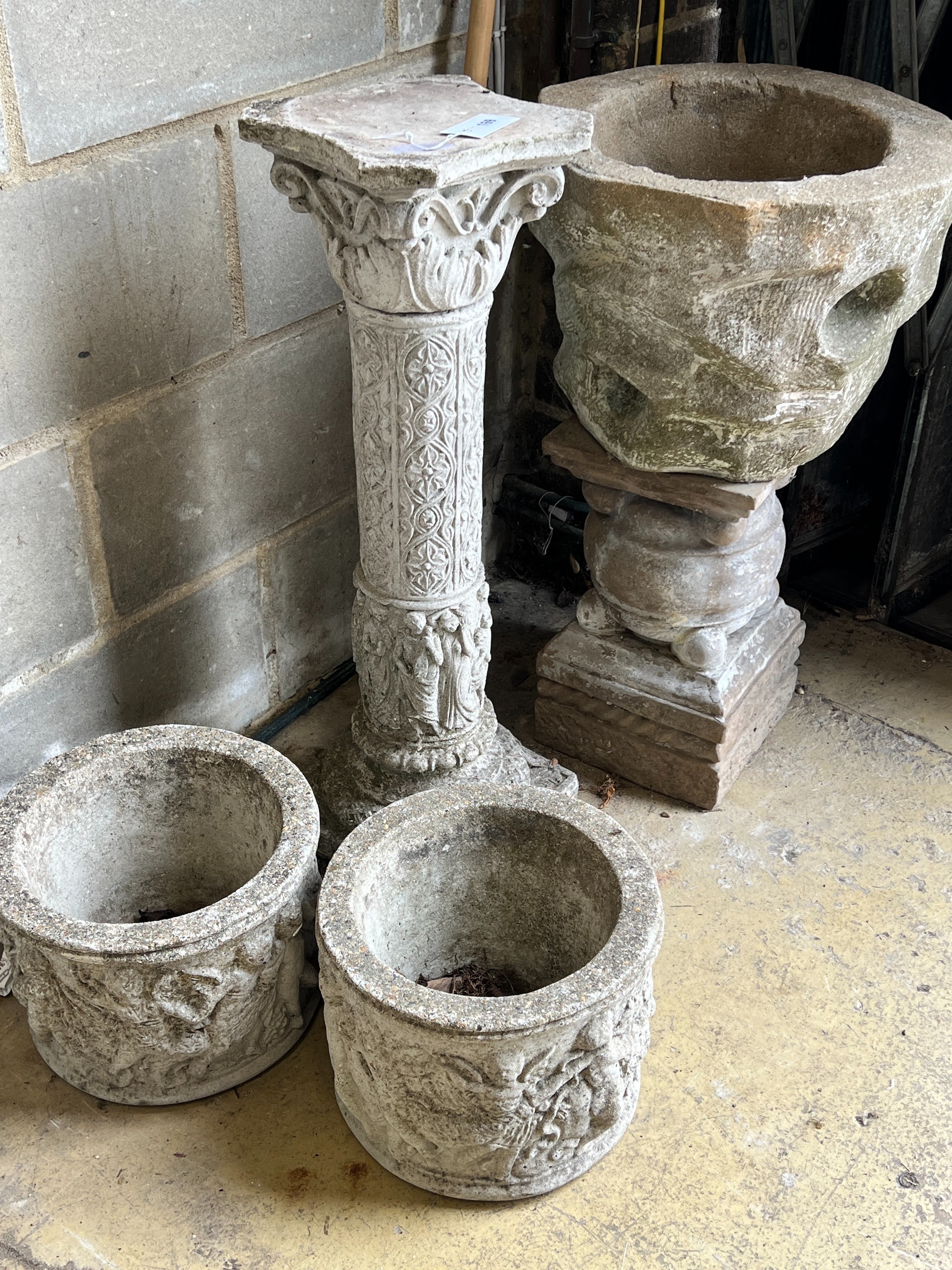 A garden planter on associated plinth, a garden column and two circular garden planters